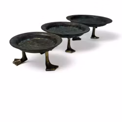 Fat Kalle Anka i grön metall och guldfötter