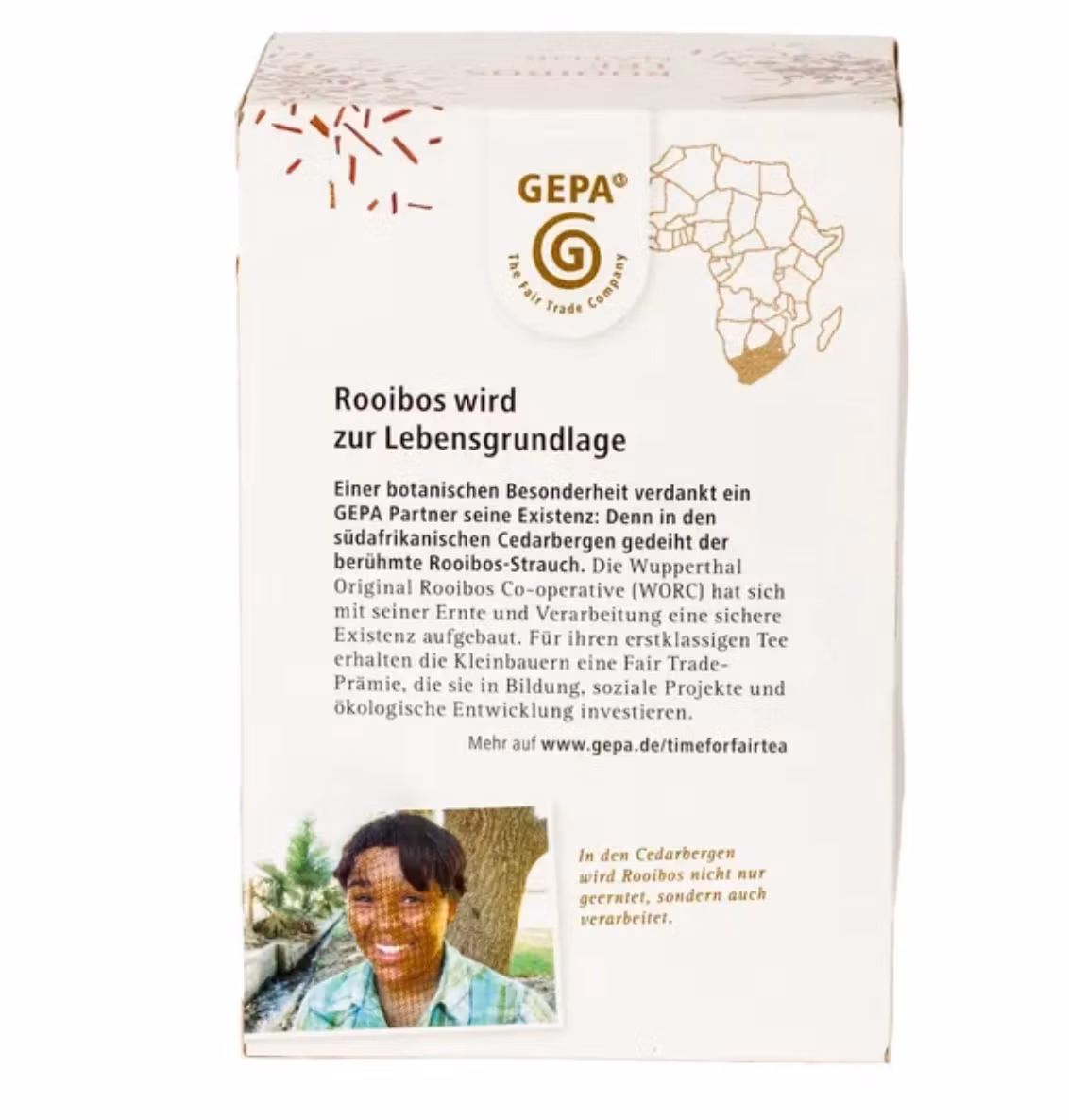 Rooibos-te i i påse. Ett koffeinfritt rent te som passar vuxna & barn. Ekologiskt Fair Trade-te från Sydafrika. Baksidan med information om kooperativet.