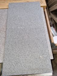 55:  Granit-plattor-mörkgrå- flammade, ca 15m2