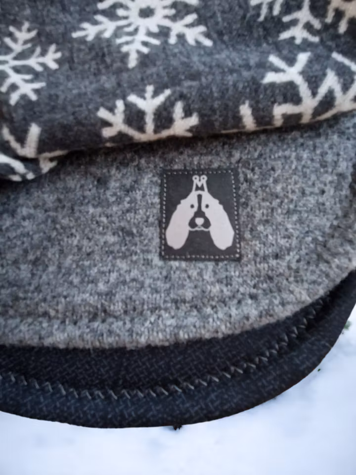 Grått ulldekken med snøstjerner L