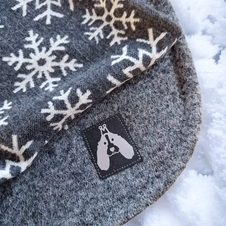Grått ulldekken med snøstjerner L