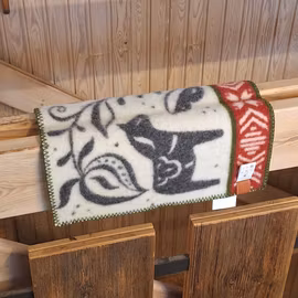 Sittunderlag i ull (mönster Dalarna)