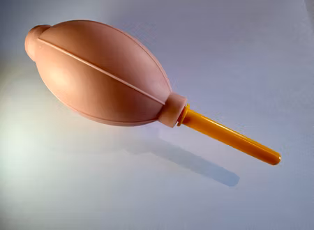 Dammblåsare, bälgblås för optik. Rosa