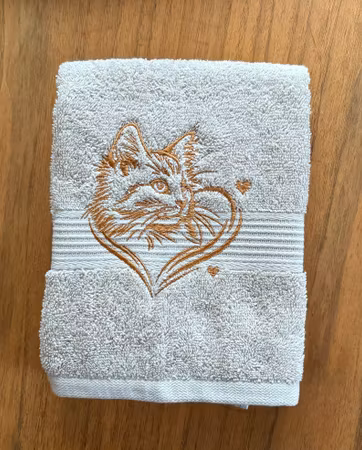 Handduk med katthuvud i hjärta