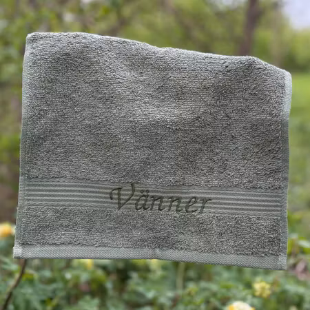 Gästhandduk med broderad text "Vänner"