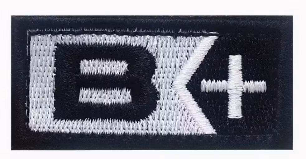 B + Pos - Svart- Silver  - Patch