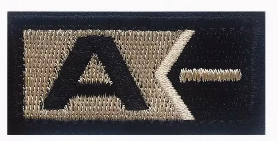 A - Neg - Guld- Svart - Patch