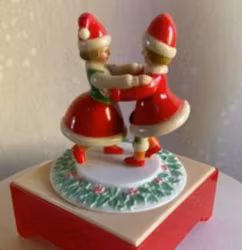 Retro speldosa i plast med två dansande tomtar