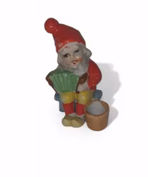 Äldre tomte som spelar dragspel har hål till ett ljus