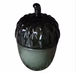 Ljusburk i glas formad som en nöt har ett doftljus  Nytt!