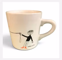 Kaffemugg med texten "Vad är design?" Design Olle Eksell