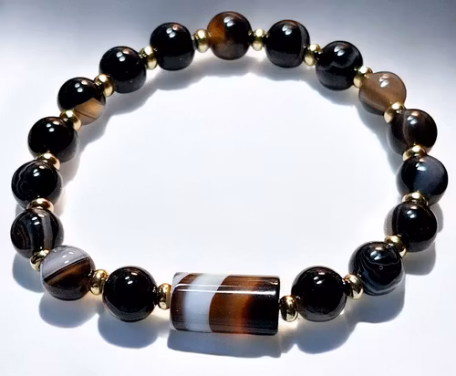 Armband med svart bandagat