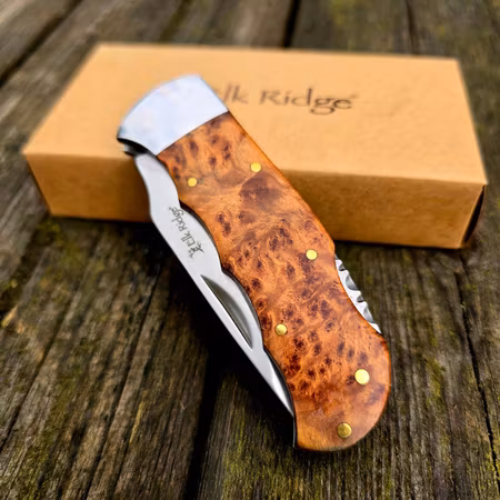 Traditionell fällkniv med handtag av vackert Burlwood och rostfritt stål