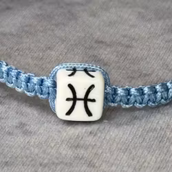 Armband med Fiskarnas Stjärntecken