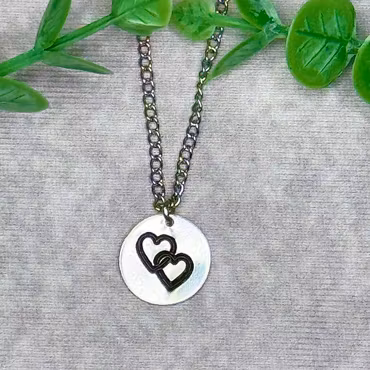 Dubbelhjärtan med personliga bokstäver