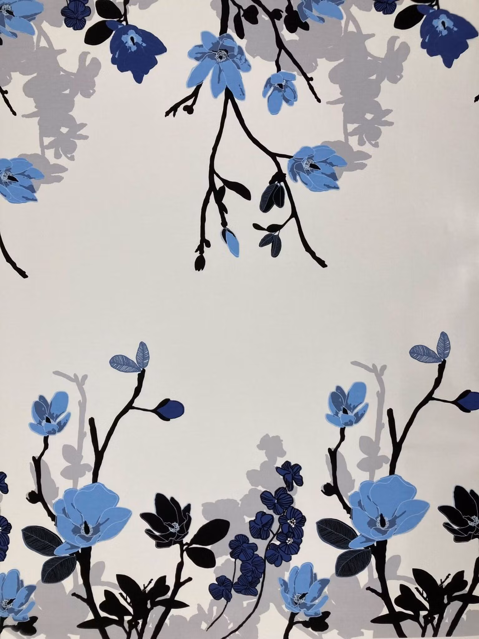 Grandiflora Ljusblå – bomullstyg med magnoliakvistar