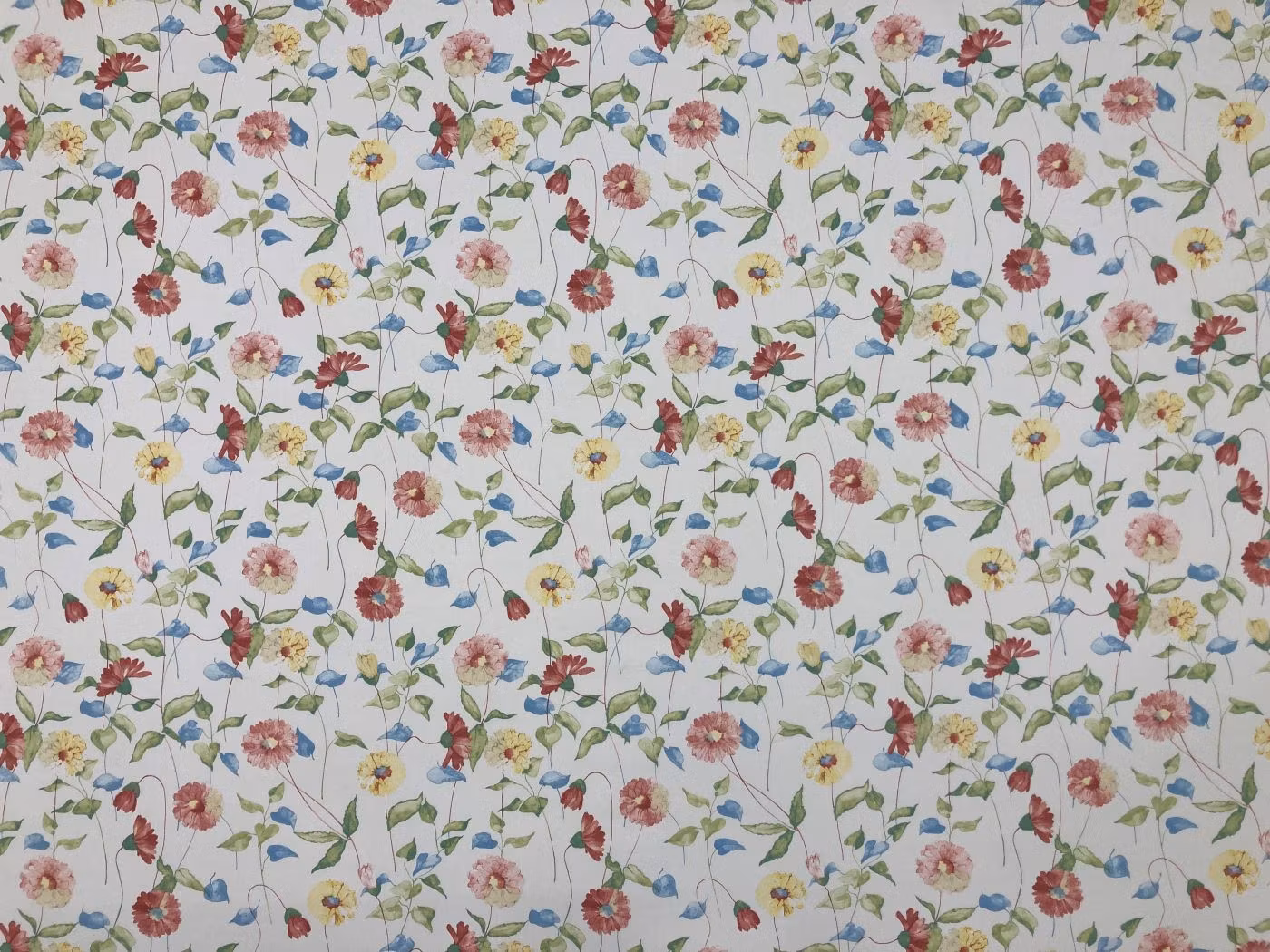 Daisy – bomullstyg med pastellfärgade blommor