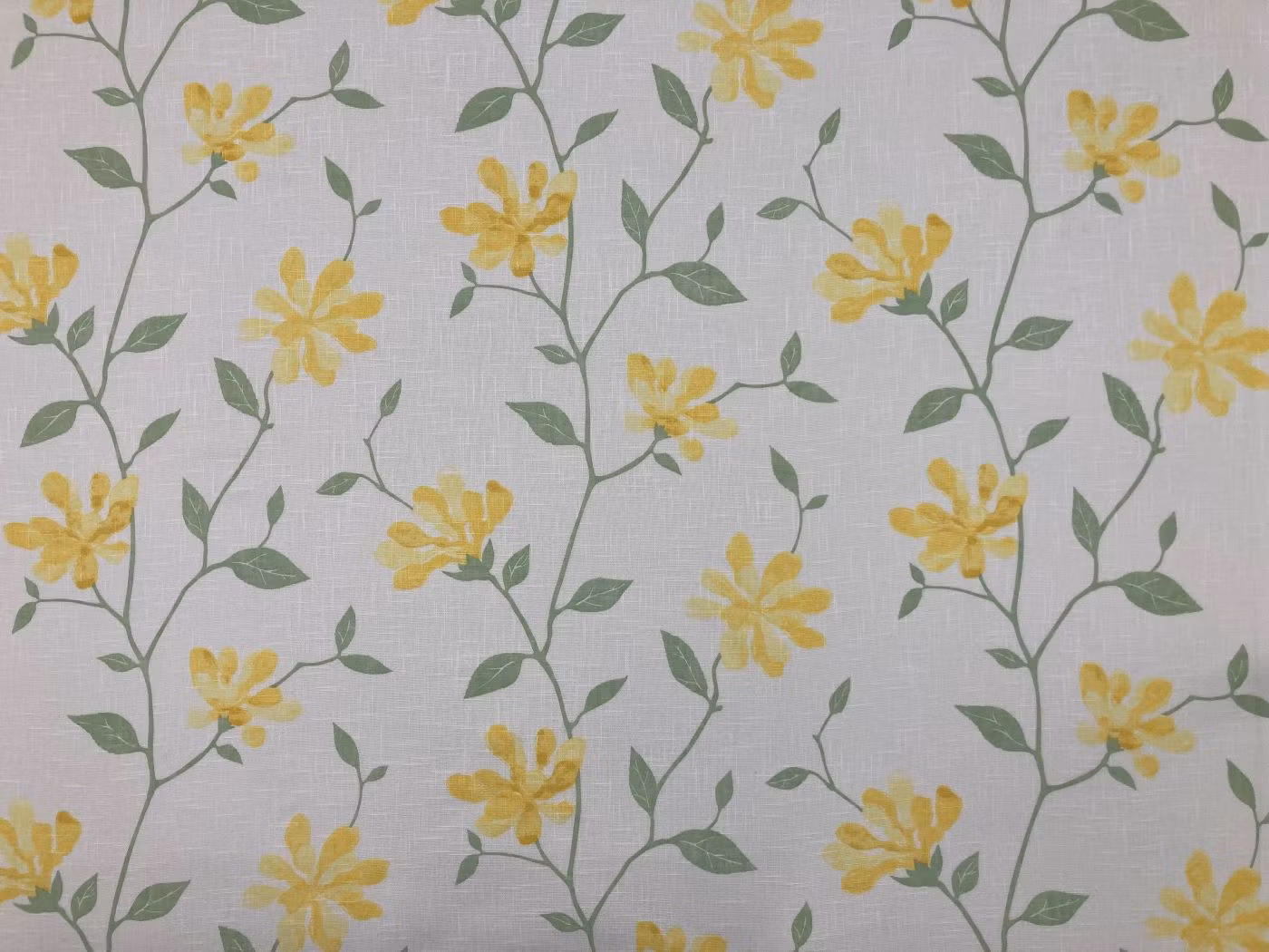 Louise gul glesvävd metervara med gula blommor på ljus botten