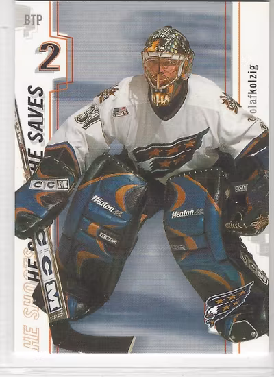 2002-03 Between the Pipes He Shoots He Saves Points #14 Olaf Kolzig 2 pt. (10-X138-CAPITALS)