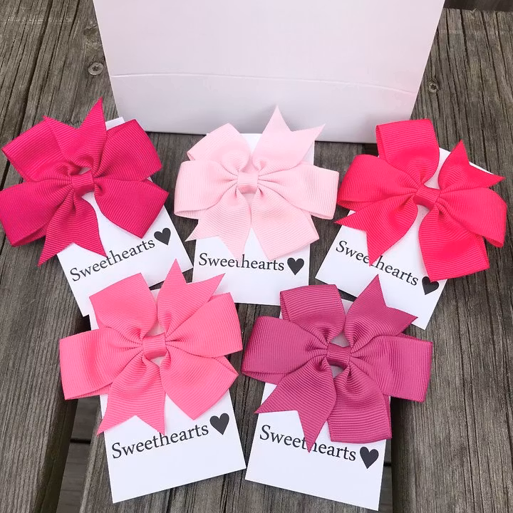 Doppresent tjej - rosa hårrosetter