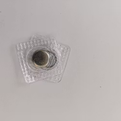 Osynligt magnetlås, magnetknapp
