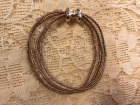 En Fin Glitter Elastisk Hårsnodd /Armband, fyra rader