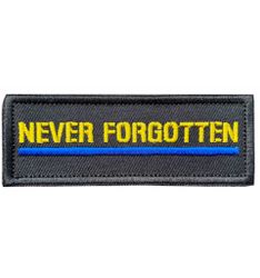 Tygmärke Never Forgotten