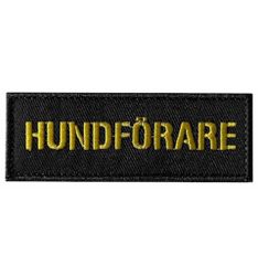 Tygmärke hundförare gul text