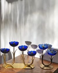 Gunnar Ander set of two Candle Holders by Ystad Metall, blue flower with brass