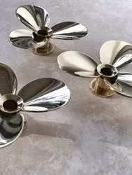 Skultuna set of three brass candle holders 'Propellern' design by Pierre Forssell