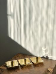 Skultuna set of three brass candle holders 'Profil No 70" design by Pierre Forssell
