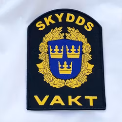 Skyddsvakt Rundad Tygmärke