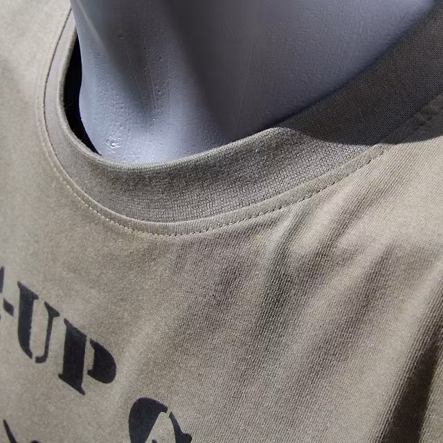 Neck close up of a T-Shirt Khaki Green TUG.
