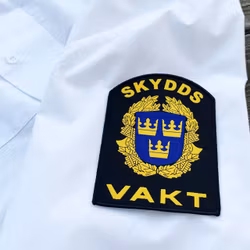 Skyddsvakt Rundad Tygmärke