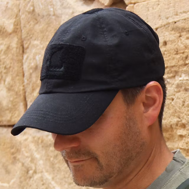 Baseball Cap Black worn in a hot environment.