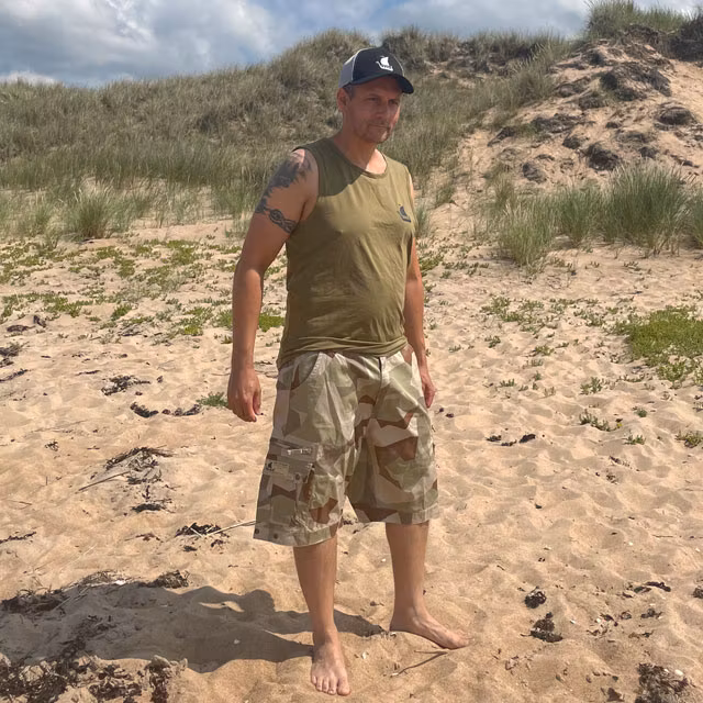 Camp Shorts M90K Desert on model on the beach