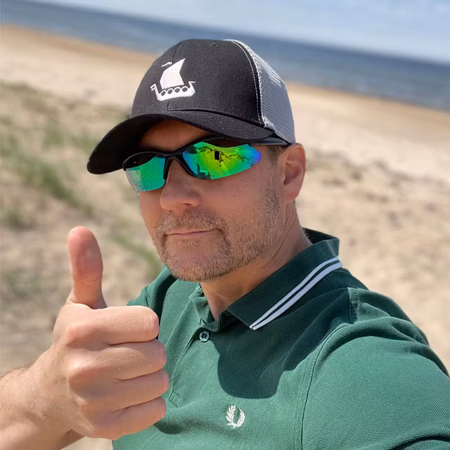 Mesh Cap Black and Grey from TAC-UP GEAR worn on model on a beach in Sweden