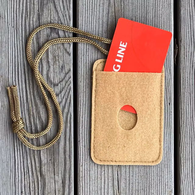 A Card holder Hook and Loop Tan with a red card in it