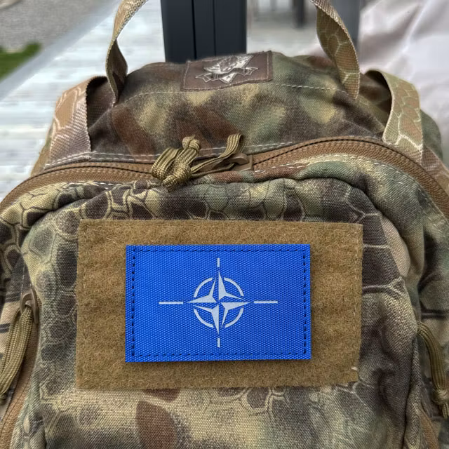 IR NATO Reflective Blue Patch displayed on a wooden surface