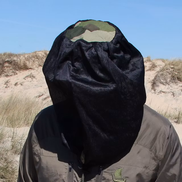 The M90 camouflage print clearly visible on the top of the Mosquito Head Net Black/M90