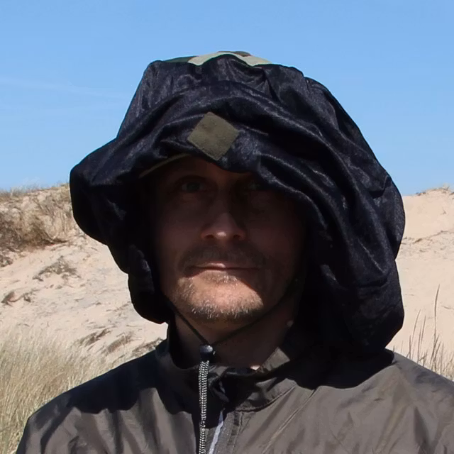 Using a Mosquito Head Net Black/M90 casually draped over a boonie hat