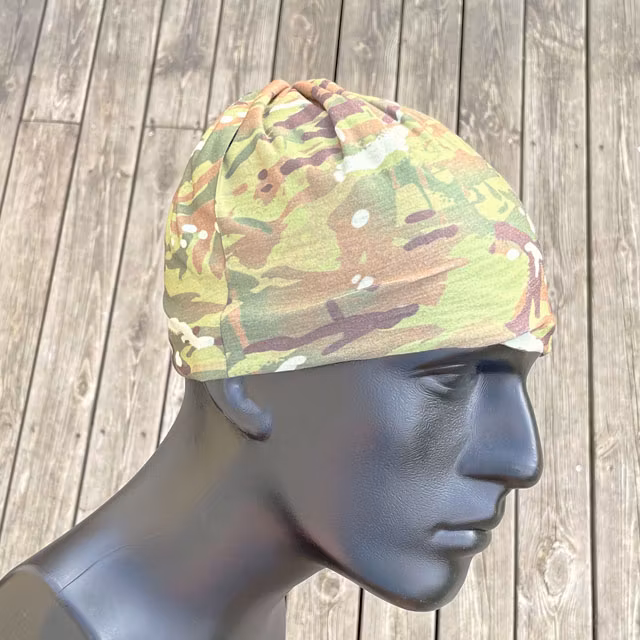 The Multiwrap Coolmax Camo from TAC-UP GEAR used as a beanie on a mannequin