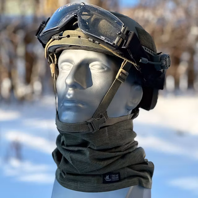 Military helmet and a Neck Tube Merino Wool Green from TAC-UP GEAR seen on a model