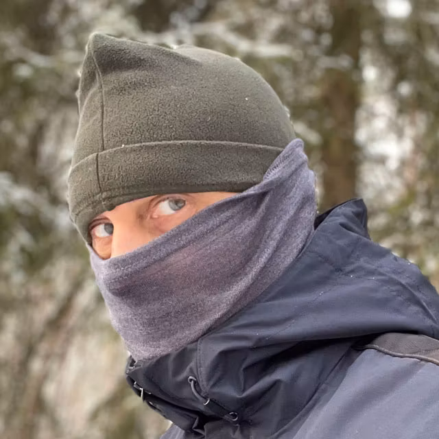 Neck Tube Merino Wool Grey from TAC-UP GEAR seen worn in Swedish winter forest on man covering face