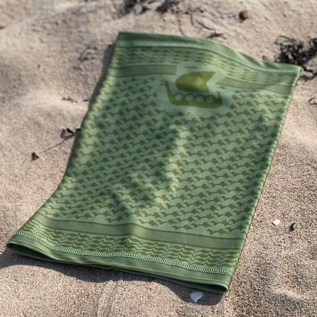 Neck Tube Shemagh Lime Green from TAC-UP GEAR lying flat on sand