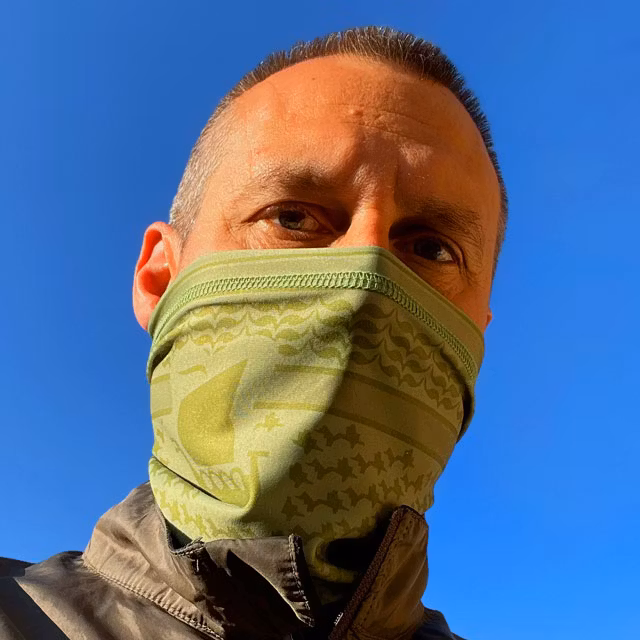 A closer look on a worn A Neck Tube Shemagh Lime Green from TAC-UP GEAR covering the nose and mouth on a model
