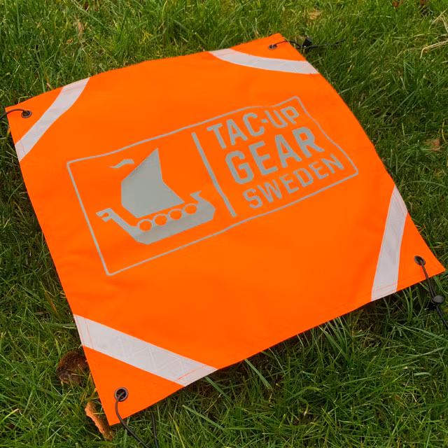 Orange Ruck Signal Panel Marker seen from the side.