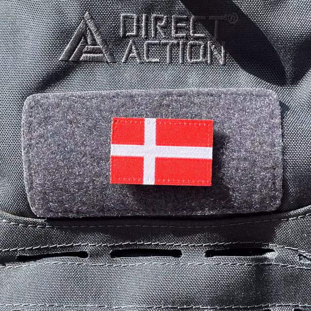 A Denmark Flag Hook Patch Small from TAC-UP GEAR mounted on a grey rucksack