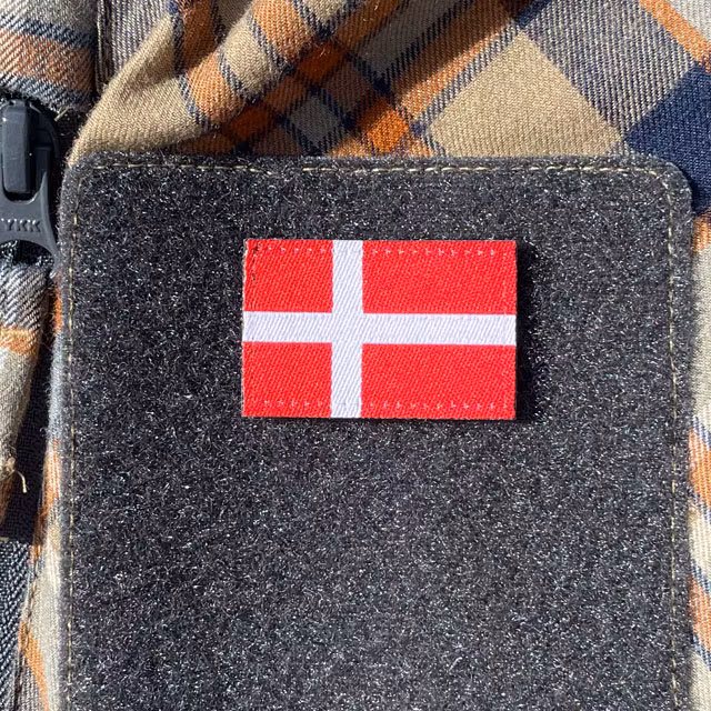 A Denmark Flag Hook Patch Small from TAC-UP GEAR mounted on velcro sleeve