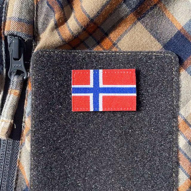 A Norway Flag Hook Patch Small from TAC-UP GEAR mounted on a velcro sleeve